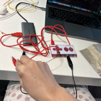 I put water on the table and put the grounding wire and red wire on it, which completed the circuit.